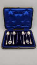 Six silver teaspoons, together with a pair of silver sugar tongs, hallmarked Sheffield 1912, boxed