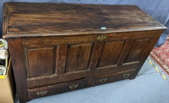 A 19th century oak coffer with a hinged lid over two drawers on extended style feet 76cm h x 139cm w
