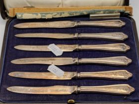 A set of six silver bladed tea knives with weighted silver handles Location: