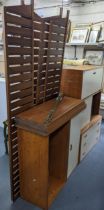 A mid 20th century Ladderax teak unit consisting of two fall flap units, chest of three drawers, two