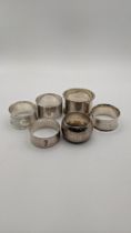 Eight silver and sterling silver napkin rings, total weight 153.2g Location: