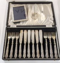 A set of six silver handled forks and knives, together with a silver picture frame, 15cm l x 11cm