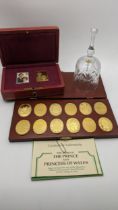 Mixed collectables relating to the Prince and Princess of Wales to include a set of 12 silver gilt