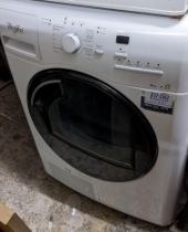 A Whirlpool washing machine Location: