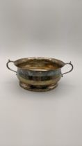 A twin handled silver bowl hallmarked Birmingham 1962, 210.9g Location: