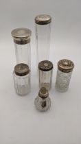 A variety of dressing table bottles al having silver lids, 54.4g, one A/F Location: