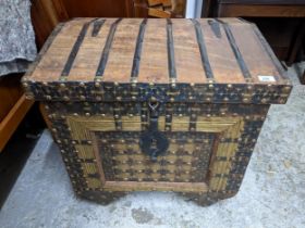 An Indian hardwood dowry chest, iron strap and brass studwork decoration, interior with storage area