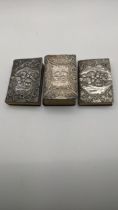Three silver books having embossed cherubs and floral scroll decoration to include Common prayer,