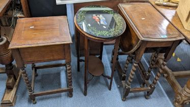 A 1930s oak drop leaf table, a mahogany oval occasional table, and a sewing table Location: