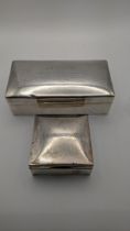 Two silver cigarette boxes 17cm w x 8.5cm w, one hallmarked 1928 Location: