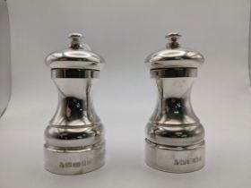 A pair of Elizabeth II silver salt and pepper grinders, London 2005, marks for M C Hersey & Son,