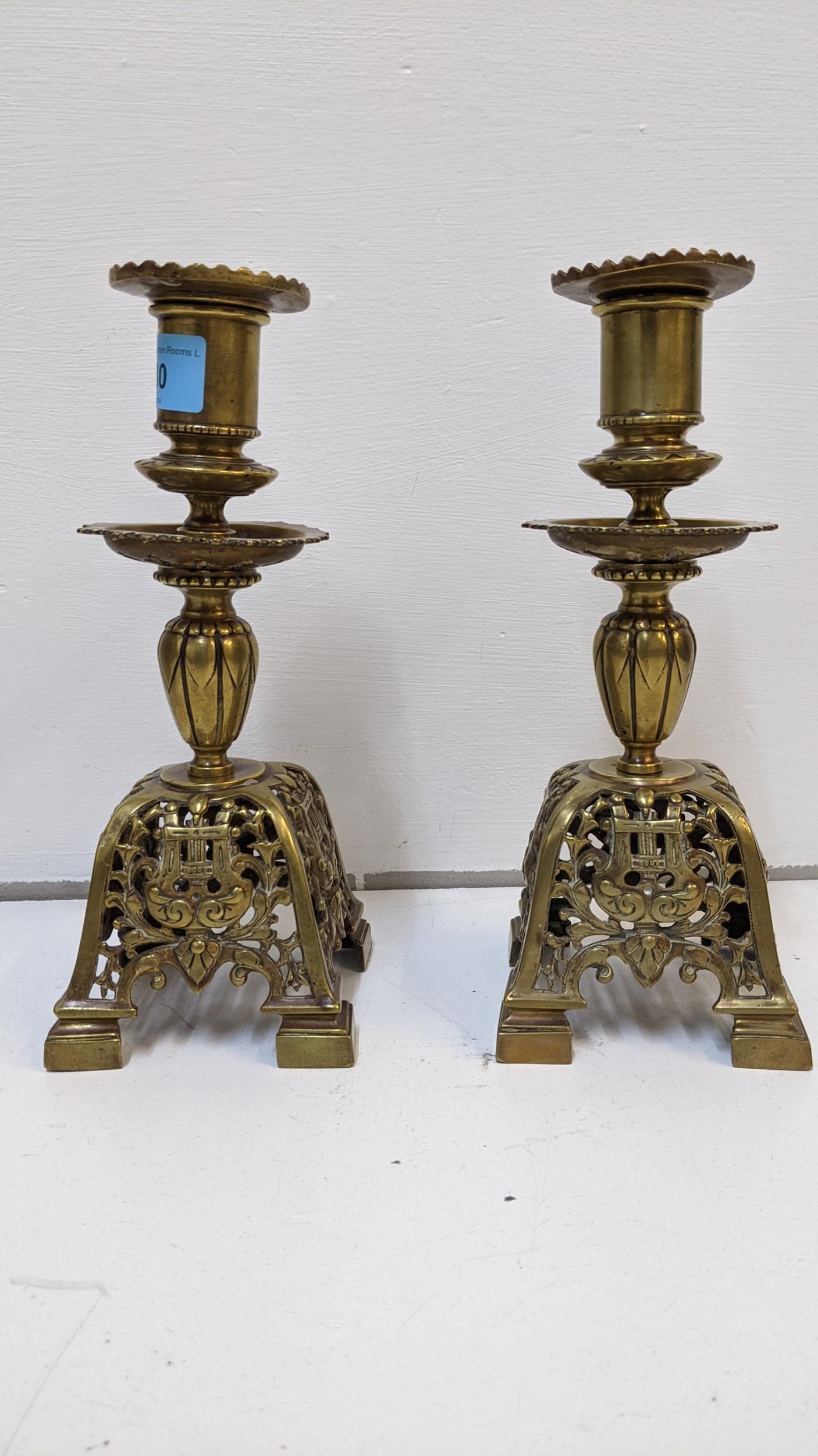 A pair of Victorian brass candlesticks with floral sway ornament, 23cm h Location: