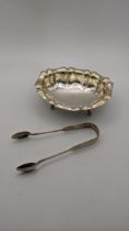 A four-footed bonbon dish hallmarked Birmingham 1995, together with a pair of sugar tongs, total