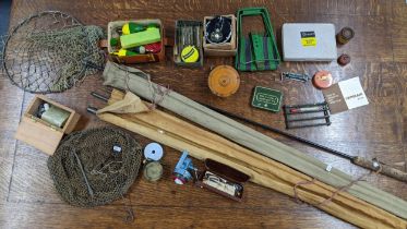 A selection of fishing related items to include reels, rods and other items Location: