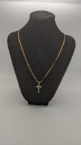 A 9ct gold chain necklace with a 9ct gold cross pendant set with diamonds, total weight 5.6g