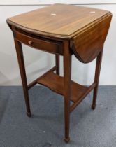 An Edwardian mahogany Pembroke table having two fall flaps, single drawer and shelf below 72cm h x