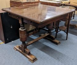 An early 20th century oak refectory table with turned columns on block legs 75cm h x 91.5cm w