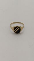 A 9ct gold and onyx signet ring, 2.4g Location: