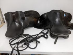Two leather horse riding saddles, a Prestige 182 saddle, and a Trium 16½ saddle, along with a