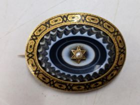 A Victorian seed pearl inset mourning brooch Location: