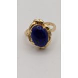 A 14ct gold ring set with Lapis Lazuli gem and diamonds 4.1g Location: