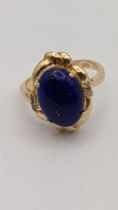 A 14ct gold ring set with Lapis Lazuli gem and diamonds 4.1g Location: