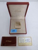 An S J Dupont gold plated cigarette lighter, serial number L 3EK80, boxed with information leaflet