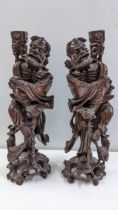A pair of Chinese root carvings of immortal figures, 40cm h Location: