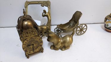 A small brass lantern clock with a French movement, 23cm h, a brass mirror, a model of a cat and