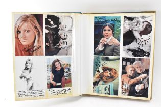 A Doctor Who album of autographs on photos, signed by several cast members to include Carole Ann