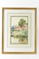 Henry John Yeend King (1855-1924) - A watercolour depicting a village scene with pond and a church