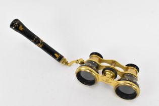 A pair of late 19th century French Flammarion gilt metal and tortoiseshell opera glasses, the handle