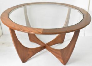 A 1960s G-Plan 'astro' teak coffee table, designed by Victor B. Wilkins, having drop in glass centre