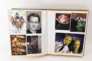 A Doctor Who album of autographs on photos, signed by several cast members to include Janet