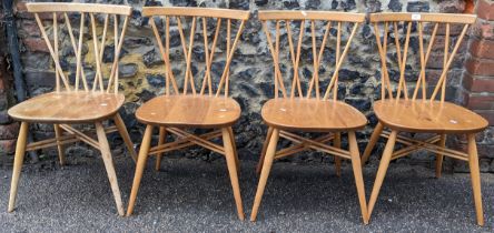 A set of four Ercol candlestick, elm and beech dining chairs, circa 1960s, model 376, having lattice