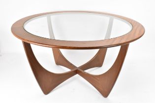 A 1960s G-Plan 'astro' teak coffee table, designed by Victor B. Wilkins, having drop in glass centre