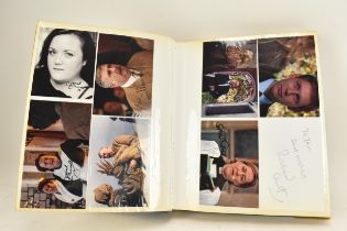 A Doctor Who album of autographs on photos, signed by several cast members to include Marie