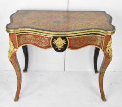 A mid 19th century French Louis XV style ebonised and red tortoiseshell boulle card table, of