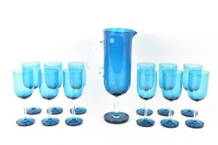 Nanny Still for Riihmaki, a turquoise glass handled juice carafe & twelve matching glasses from