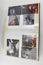 A Doctor Who album of autographs on photos, signed by several cast members to include David