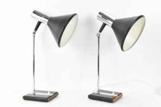 A pair of Danish style mid century chrome and teak desk lamps by German