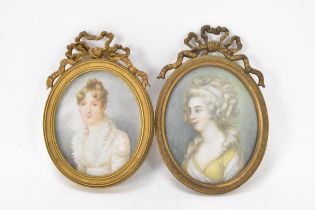 Two French 19th century ivory portrait miniatures each depicting a lady, of oval form in gilt
