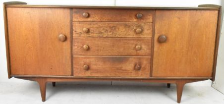 A 1960s John Herbert for A Younger & Co teak sideboard, having a central bank of four graduating