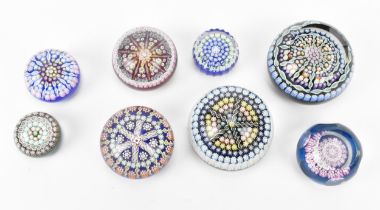 A collection of mainly Perthshire paperweights, comprising eight in total, all designed with
