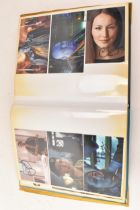 A Doctor Who album of autographs on photos, signed by several cast members to include Wendy Padbury,