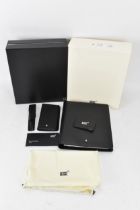 A collection of Mont Blanc Meisterstuck black leather accessories to include a notebook, pen case