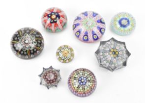 A collection of mainly Strathearn paperweights, comprising eight in total, two in the pressed star