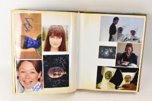 A Doctor Who album of autographs on photos, signed by several cast members to include Louise