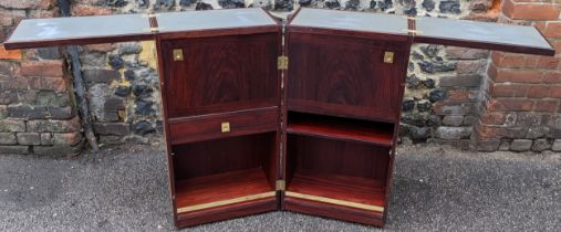 A 1960s Skovby for Dyrlund exotic wood captains bar, with fold-out tops above fitted drawer, open