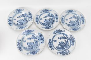 A set of five 18th century English Delft plates, in the Chinese manner decorated in blue and white